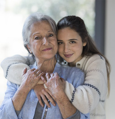 Young woman hugging grandmother (photo)